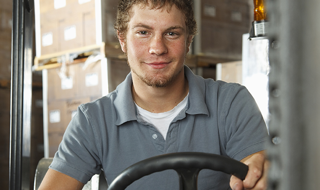 Image of man on a forklift