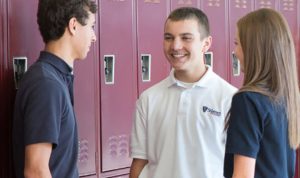students talking by their lockers