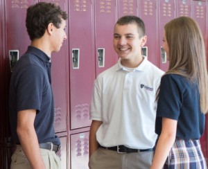 students talking by their lockers