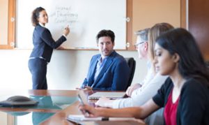 meeting with woman at white board