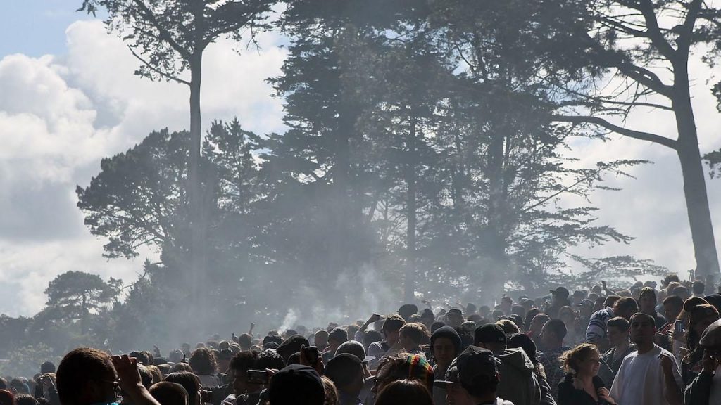 Concert with marijuana smoke in the air.
