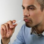 Man taking an Oral-Eze drug test